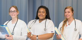 CNA students pose in the CNA Lab on campus in Battle Creek.