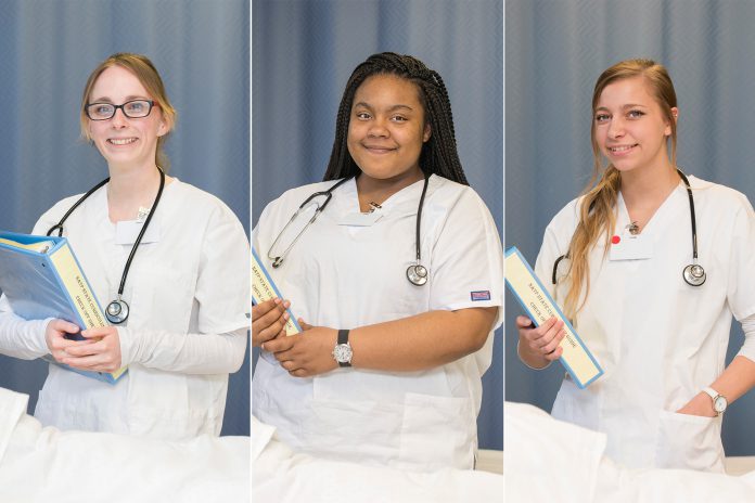 CNA students pose in the CNA Lab on campus in Battle Creek.