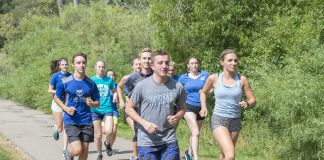 KCC cross-country runners run around Spring Lake.