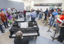 KCC choir members rehearse in the choir room.