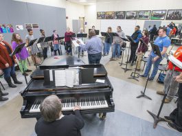 KCC choir members rehearse in the choir room.