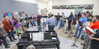 KCC choir members rehearse in the choir room.