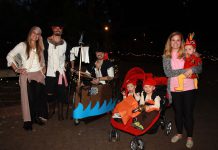 Group shot of people dressed up in halloween costumes.