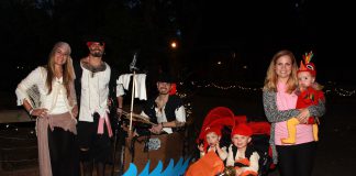 Group shot of people dressed up in halloween costumes.