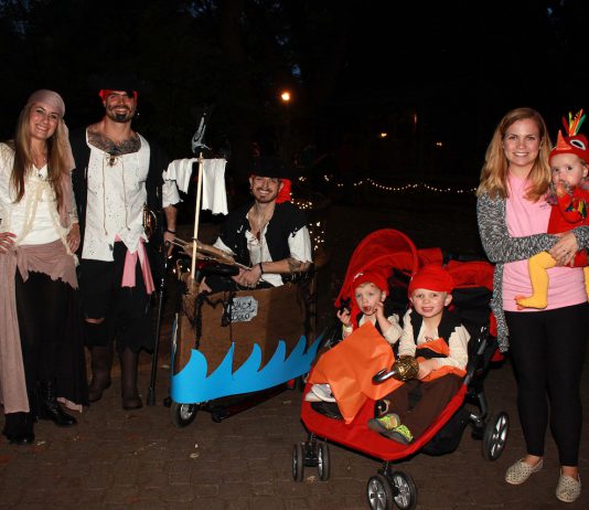 Group shot of people dressed up in halloween costumes.