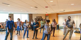 Hustle Dance Class in the Kellogg Room. Participants learning to dance.