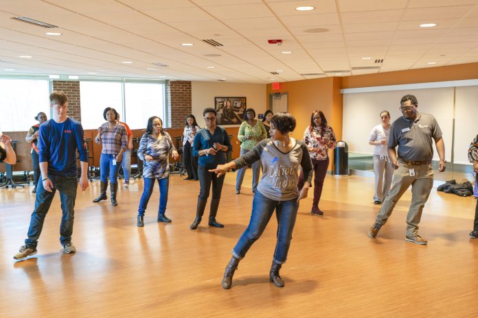 Hustle Dance Class in the Kellogg Room. Participants learning to dance.