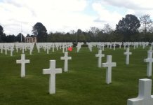 Cemetery grave sites, mostly crosses.