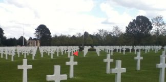 Cemetery grave sites, mostly crosses.