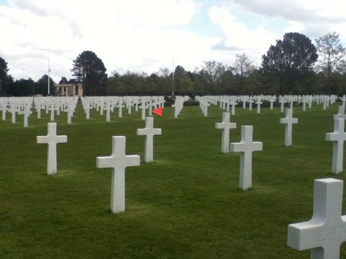 Cemetery grave sites, mostly crosses.