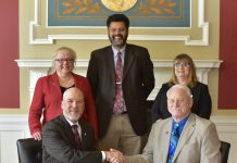 KCC's Vice President and President sitting with deans and instructors from Olivet College