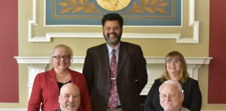 KCC's Vice President and President sitting with deans and instructors from Olivet College