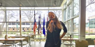 Drea singing karaoke in the Student Center at KCC