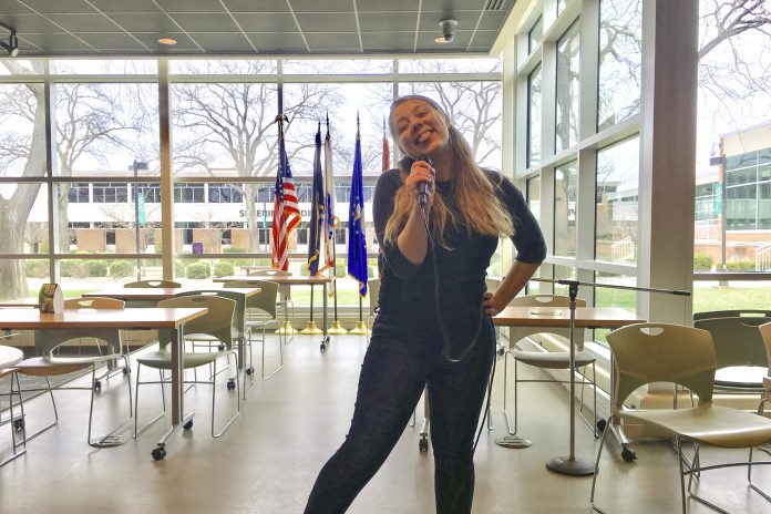 Drea singing karaoke in the Student Center at KCC