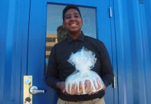 Jordan Edwards holding a baked good.