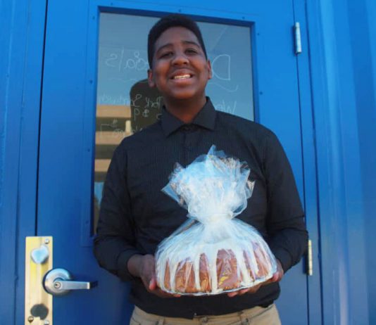 Jordan Edwards holding a baked good.