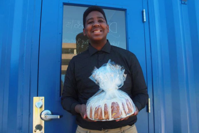 Jordan Edwards holding a baked good.