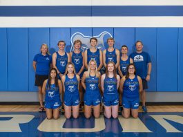 the 2020 KCC Cross Country teams pose for a photo in the gym