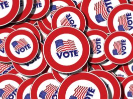 Voting pins that say Vote