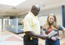 KCC campus security conversing with a student