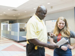 KCC campus security conversing with a student