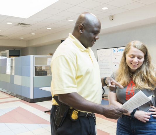 KCC campus security conversing with a student