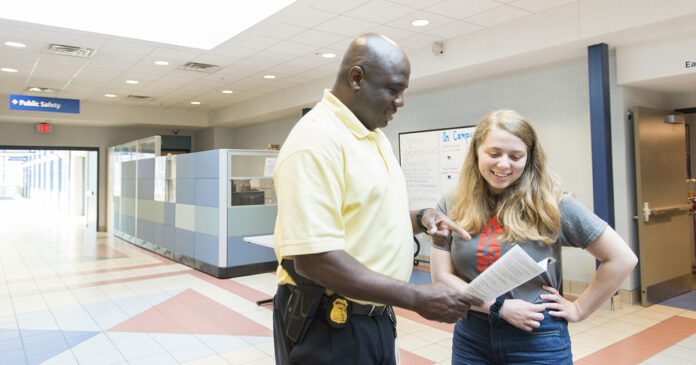 KCC campus security conversing with a student