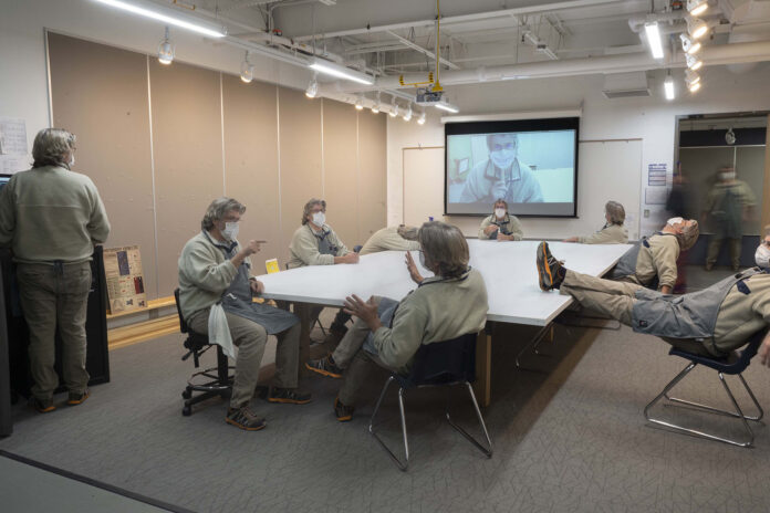 A classroom full of different versions of the same person in different poses.