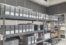 Boxes stacked on shelves in the KCC archives.