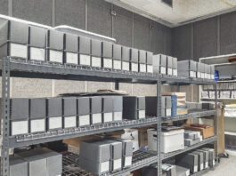 Boxes stacked on shelves in the KCC archives.