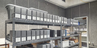 Boxes stacked on shelves in the KCC archives.