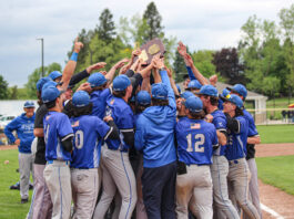 KCC baseball players celebrate after winning the regional championship. Photo by Allie Dietzel.