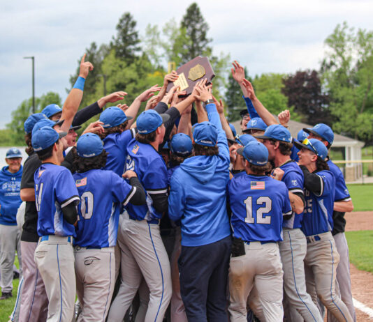 KCC baseball players celebrate after winning the regional championship. Photo by Allie Dietzel.
