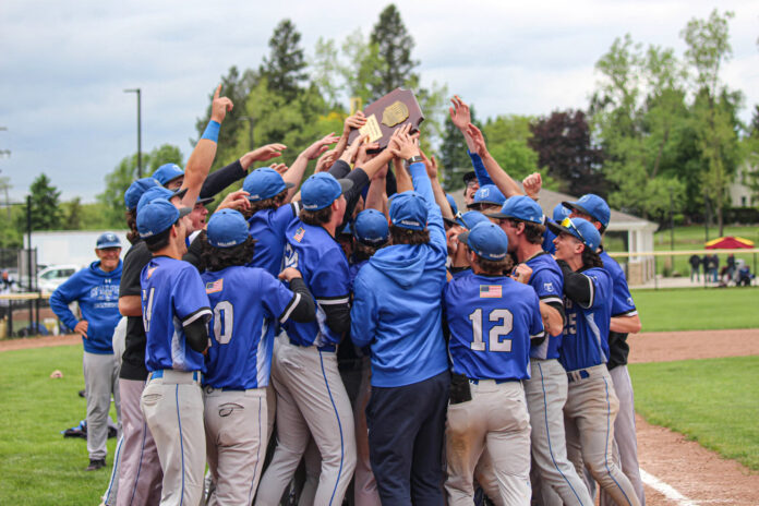 KCC baseball players celebrate after winning the regional championship. Photo by Allie Dietzel.